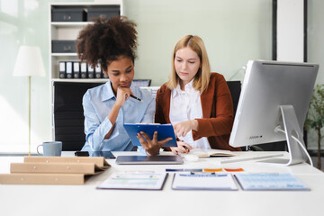 Diverse professionals collaborate on project analysis with financial graphs.