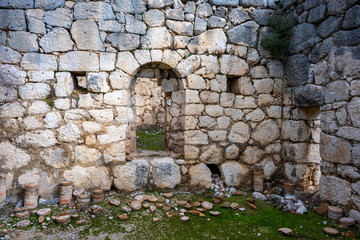 Remains of gymnasium in acnient Lycian city Arycanda. Ancient city on mountain near Aykiricay village.Well preserved semi-circular theater of Arycanda, ancient Lycian city in Antalya