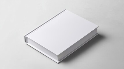 Fototapeta premium Blank White Book on a Textured Gray Surface