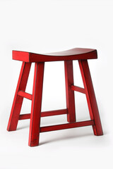 Red wooden stool featuring curved saddle-style design, offering minimalist seating comfort