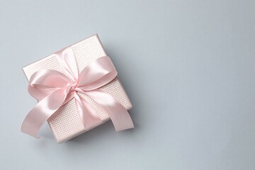 Beautiful gift box on pink background
