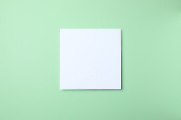 White paper card on green background