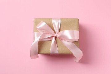 Beautiful gift box on pink background
