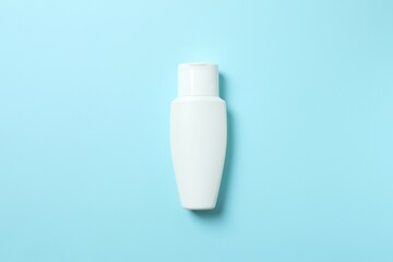 Natural cosmetic products. Cosmetic bottle on a blue background, top view