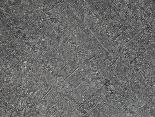 Abstract black and white concrete texture with speckled surface pattern. Weathered cement wall with porous finish. Industrial grunge background