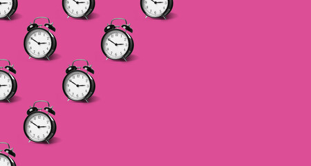 Black alarm clocks on violet red background, pattern. Banner design with space for text