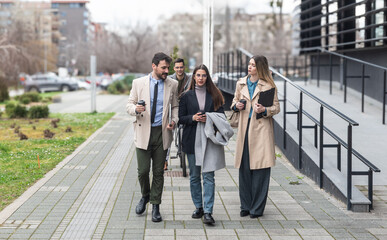 Professional occupation, office workers. Business people meet before staff meeting and presentation in office building, to talk and discus plans and tactic of speech theme. Finance and economy.