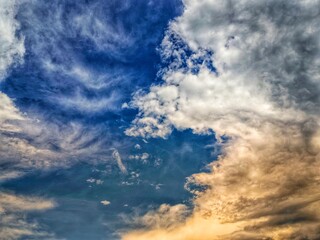 Fototapeta premium view of Golden Clouds in Blue Sky