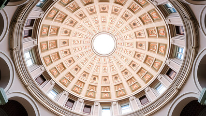 The Pantheon's dome in Rome, a landmark of Italian architecture, showcases the interior of a historic religious building with its impressive cupola