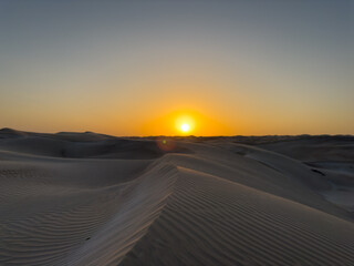 Sunset at the white sands desert also known as Sugar Dunes in Sultanate of Oman