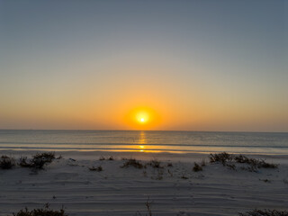 Sunset at the white sands desert also known as Sugar Dunes in Sultanate of Oman