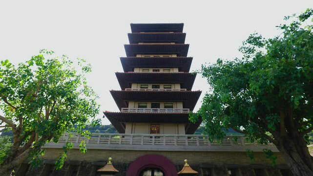 Heading towards pagoda behind 2 trees at Fo Guang Shan Buddha Museum in Taiwan