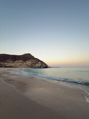 Afoul Beach view with lagoon at the end and very challenging access via canyon in dry riverbed, Salalah, Southern Oman
