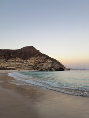 Fototapeta premium Afoul Beach view with lagoon at the end and very challenging access via canyon in dry riverbed, Salalah, Southern Oman