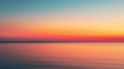 Obraz premium A serene sunset over calm waters, blending vibrant hues of orange, pink, and blue, creating a peaceful ambiance.