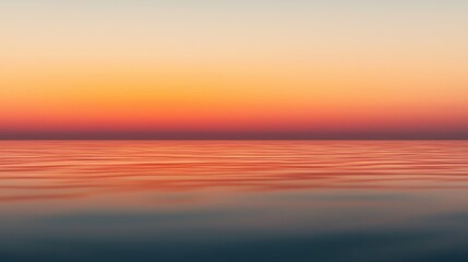 Obraz premium A serene sunset over calm waters, blending warm colors of orange and pink against a gentle horizon, evoking tranquility and natural beauty.