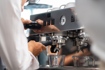 Barista expertly operating an espresso machine to create the perfect coffee shot
