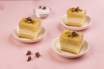 Basbousa is Egyptian Semolina Cake with Cream and Pistachio.