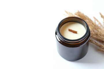 Handmade scented candle in a glass. Soy wax candle with a wooden wick