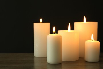 Burning candles in a dark space