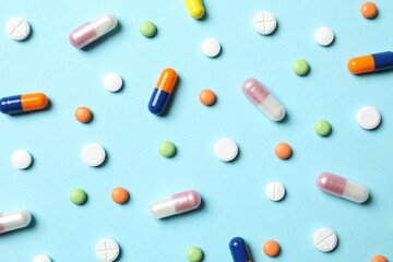 Various pills on blue background