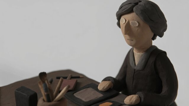  the elderly artist reflects on the memories while crafting a new layout inspired by the stories intertwined in their past creations.. art illustration