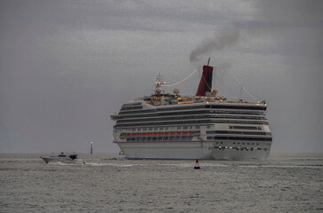 Family cruiseship or cruise ship ocean liner Victory during sunset and twilight in port of Miami,...