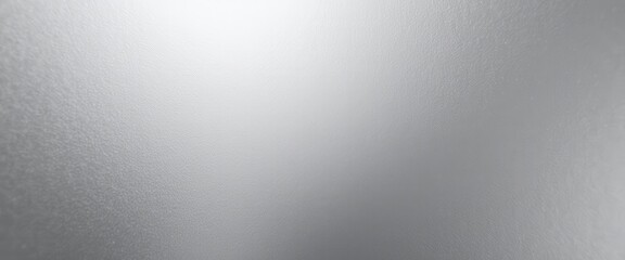 CloseUp of Silver Surface: Smooth, Glossy Finish Illuminated in Elegant Reflection. A close up of a frosted glass surface.