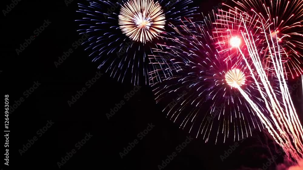 Poster brilliant fireworks bursting against dark nighttime sky, creating mesmerizing slow motion display of