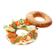 Delicious bagel with salmon, cream cheese and cucumber isolated on white