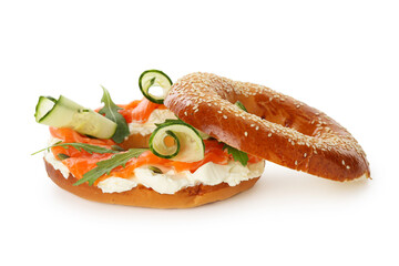 Delicious bagel with salmon, cream cheese and cucumber isolated on white