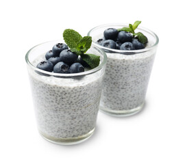 Delicious chia pudding with blueberries and mint in glasses isolated on white