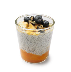Delicious chia pudding with blueberries, banana and oatmeal in glass isolated on white