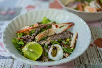 A bowl of special food of dry egg yellow noodle with crawfish, shrimp and crab, sold in Chanthaburi province, Thailand