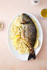 Baked dorado with lemon and couscous