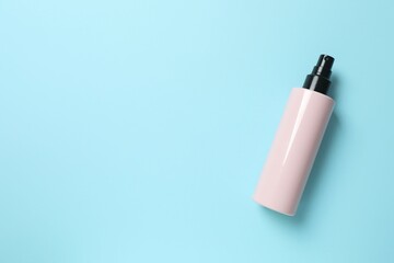 Natural cosmetic products. Cosmetic bottle on a blue background, top view