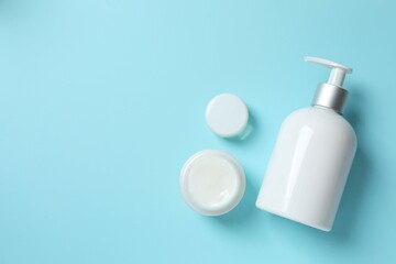 Natural cosmetic products on a blue background, top view