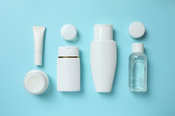 Natural cosmetic products on a blue background, top view