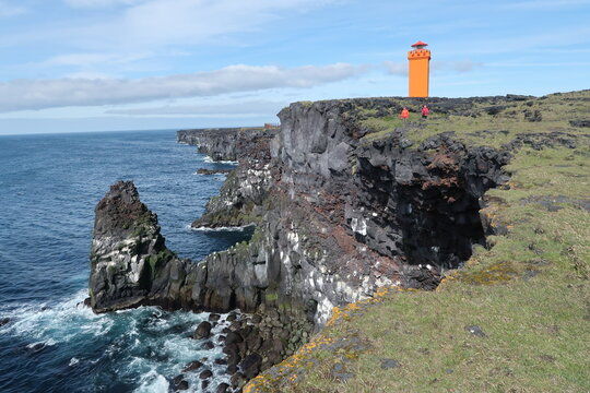 Iceland, wild nature in the land of fire and ice, flocks of sheep, horses and ponies in vast meadows, volcanoes surrounded by black lava fields, glaciers, ice floes floating in the ocean, waterfalls