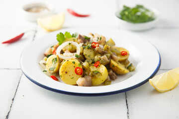 Homemade potato salad with herring