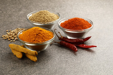 Various spices in a bowls on stone background. Mix spices Indian spices food and cuisine ingredients