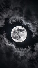 Naklejka premium A luminous full moon surrounded by wispy clouds in a dark sky, creating an enchanting night scene.
