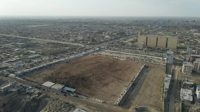 Drone footage from traditional Central Asian sport "Buzkashi" in which horse-mounted players attempt to place a goat or calf carcass in a goal, in Balkh, Afghanistan. March 21, ?2021