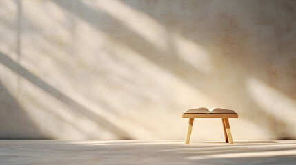Open book on small wooden stool in soft natural sunlight. Perfect for reading inspiration, mindfulness themes, and minimalist interior design. Selective focus