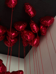 Red Heart-Shaped Balloons on the Ceiling