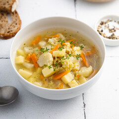 Homemade clear soup with cauliflower