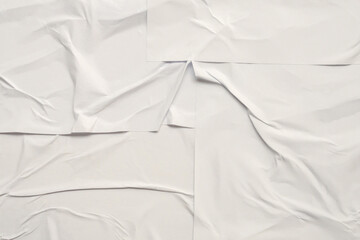 white crumpled and creased glued wrinkled paper poster texture background