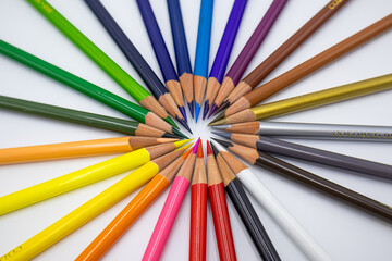 Useful office supplies such as colorful pencils and coloring