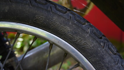 Close-up of a Motorcycle Tire with Brand and Model Engraving