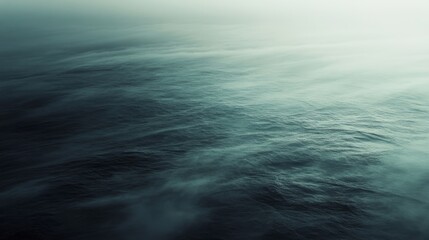 Obraz premium A misty, ethereal ocean view defies the boundary between sea and sky, creating a seamless blend of tranquility and limitless exploration.